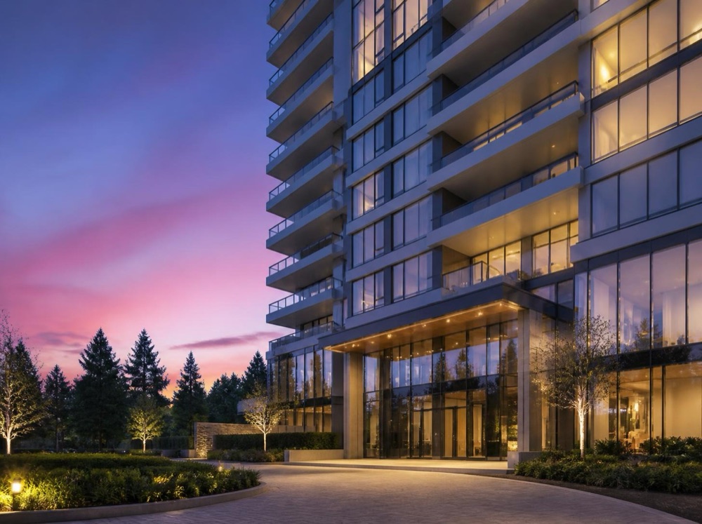 A glass condo tower at twilight
